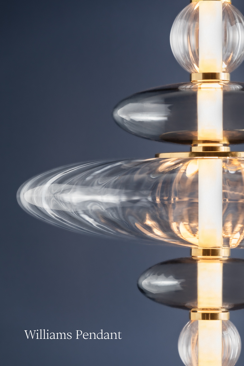 Stacked clear and smoked glass shades surround a central LED tube, forming a captivating totemic design on the Williams Chandelier by Hudson Valley Lighting